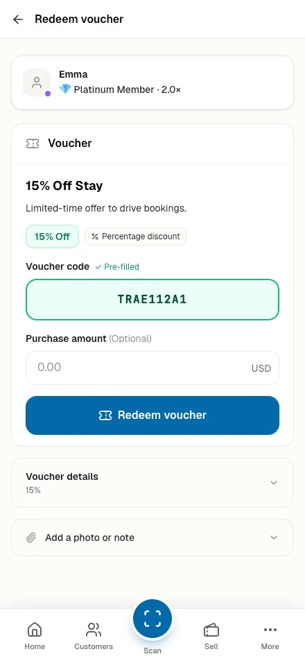Staff phone redeeming a customer's voucher code at the counter