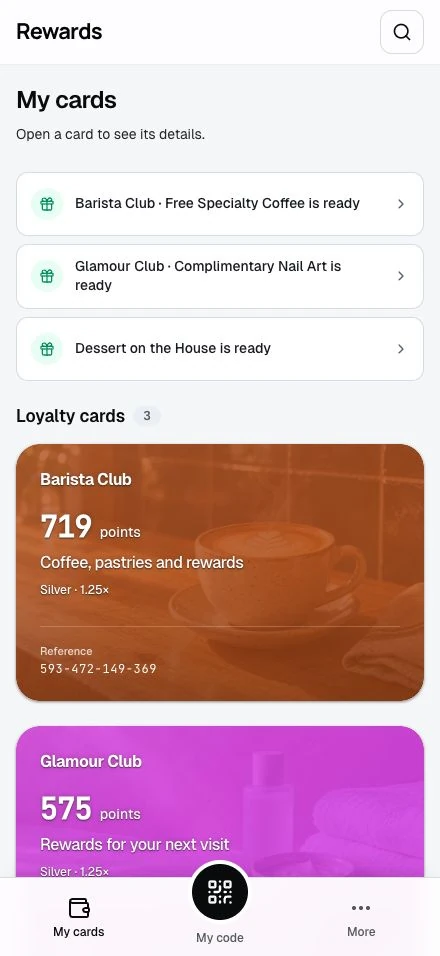 The member wallet with current loyalty cards and the My cards, My code, and More navigation.
