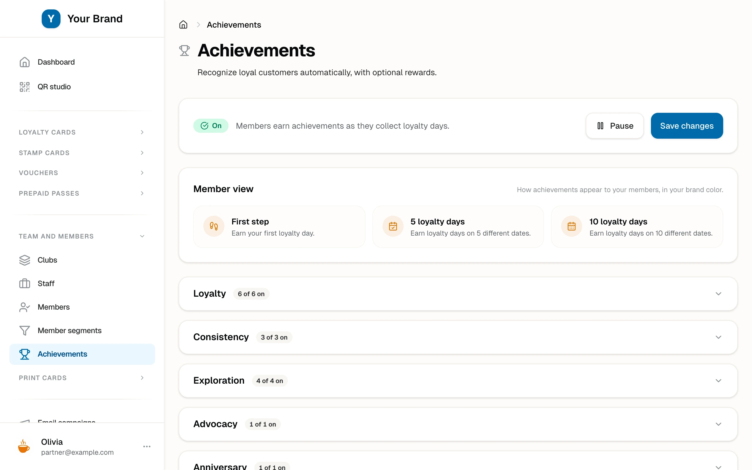 The partner achievements page with the programme switched on, a member-view preview of the first milestones, and the milestone groups (Loyalty, Consistency, Exploration, Advocacy, Anniversary) showing how many are switched on.