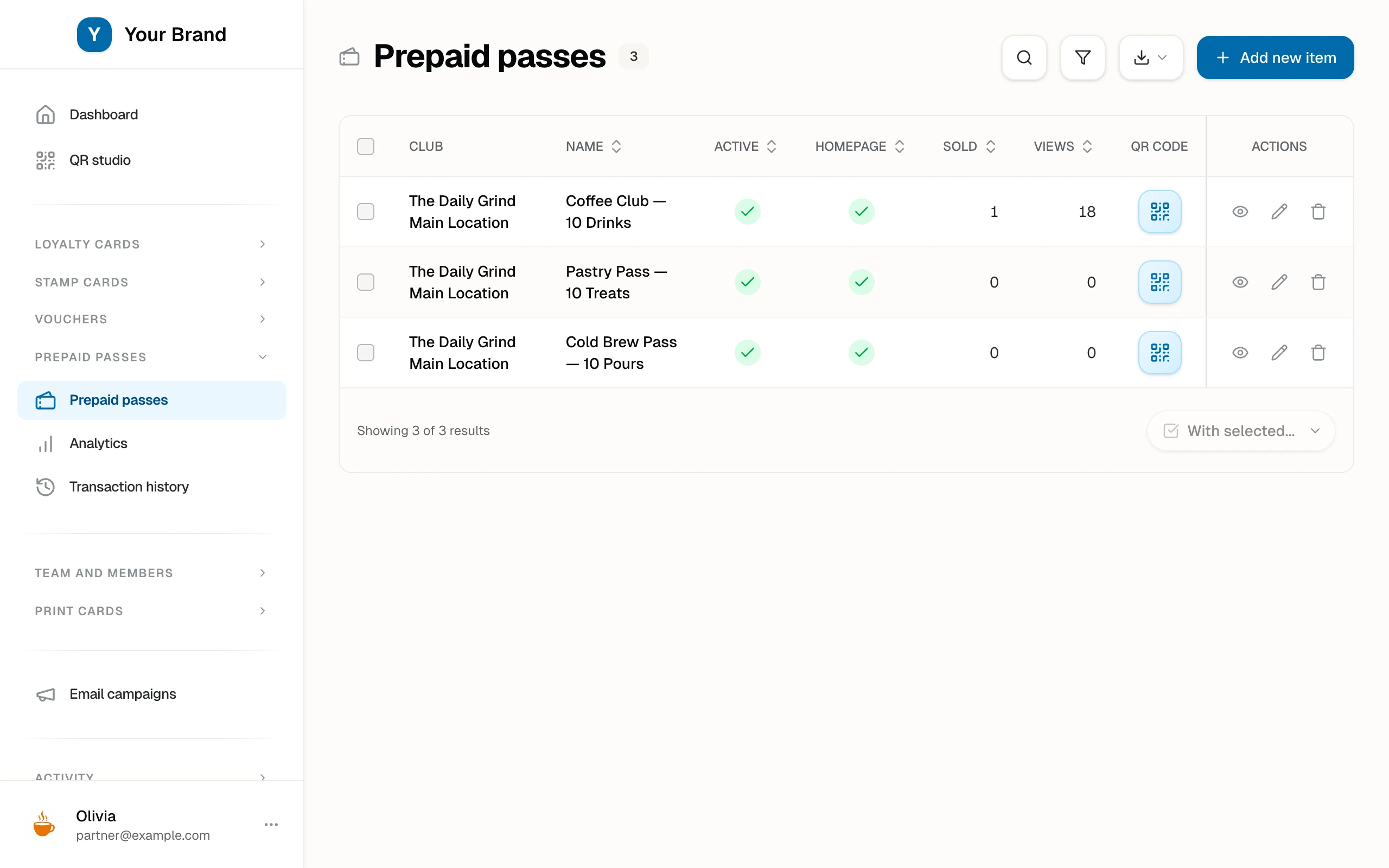 The pass products list with three designed passes, their sold and view counts, and per-product QR codes.