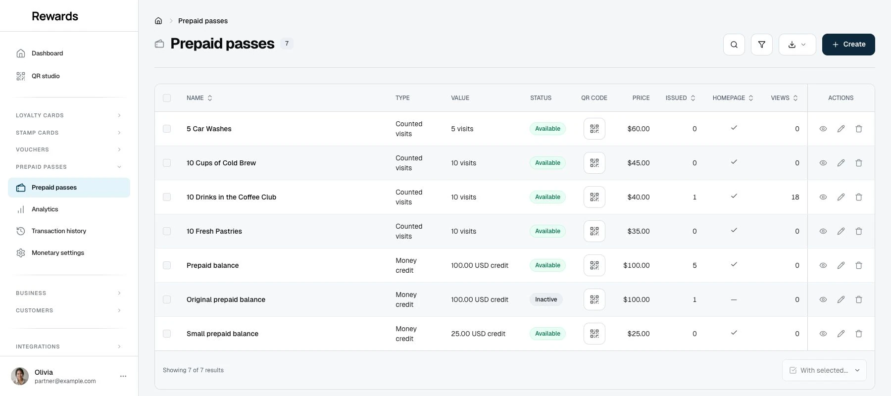 The pass products list with three designed passes, their sold and view counts, and per-product QR codes.