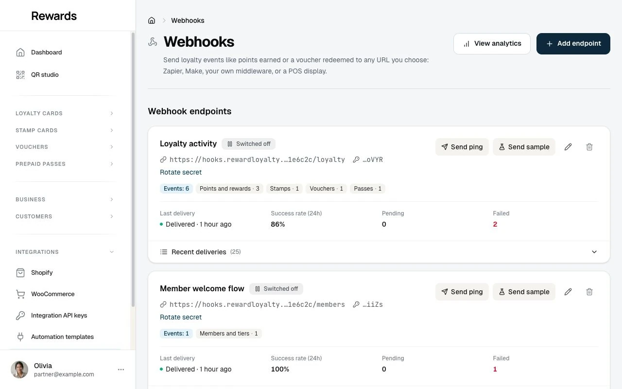 The Webhooks screen in the business dashboard, with paused example endpoints and their subscribed events.
