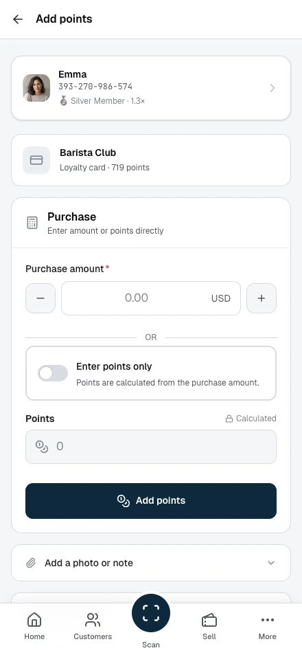 Staff review the purchase amount before adding points.