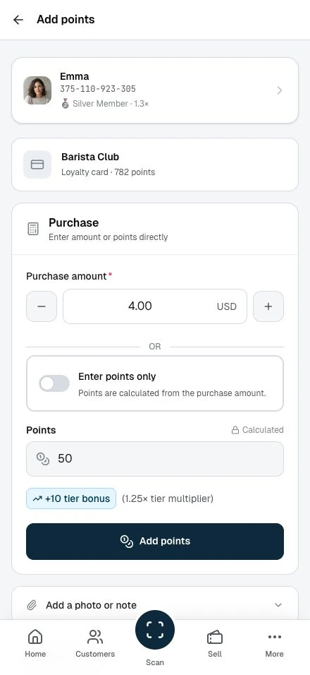 Staff enter a purchase amount and review the points before confirming.